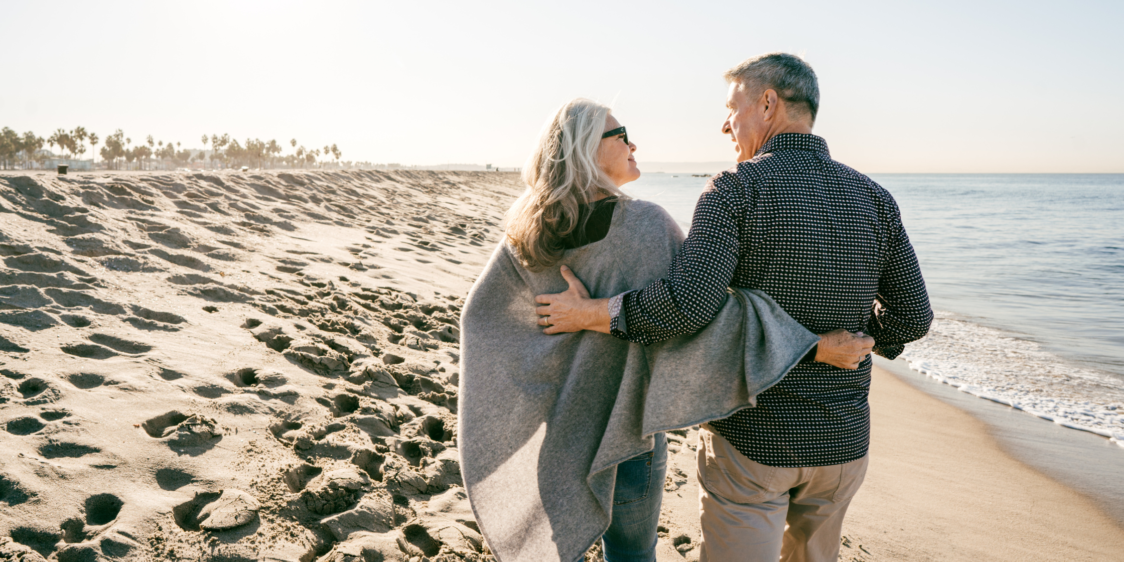Couple on the beach on a sunny day.