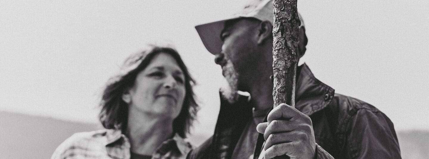 Two people looking at each other in black and white.