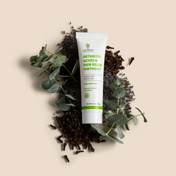 Product Image for Tube of arthritis pain relief ointment surrounded by leaves on a beige background