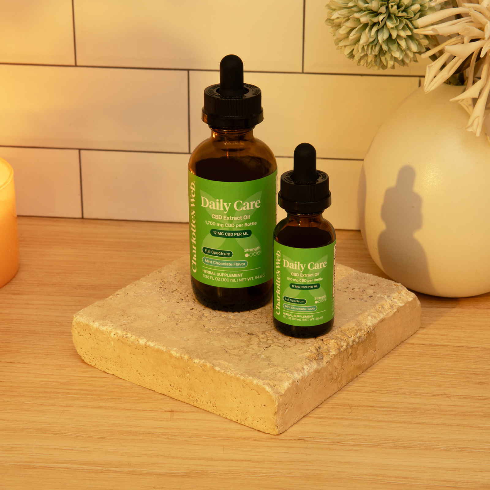 Product Image for Two bottles of &#39;Daily Care&#39; on a stone coaster with a neutral background
