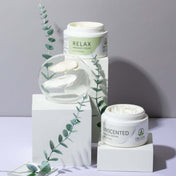Product Image for Massage cream jars with &#39;Relax&#39; and &#39;Unscented&#39; labels on a gray background