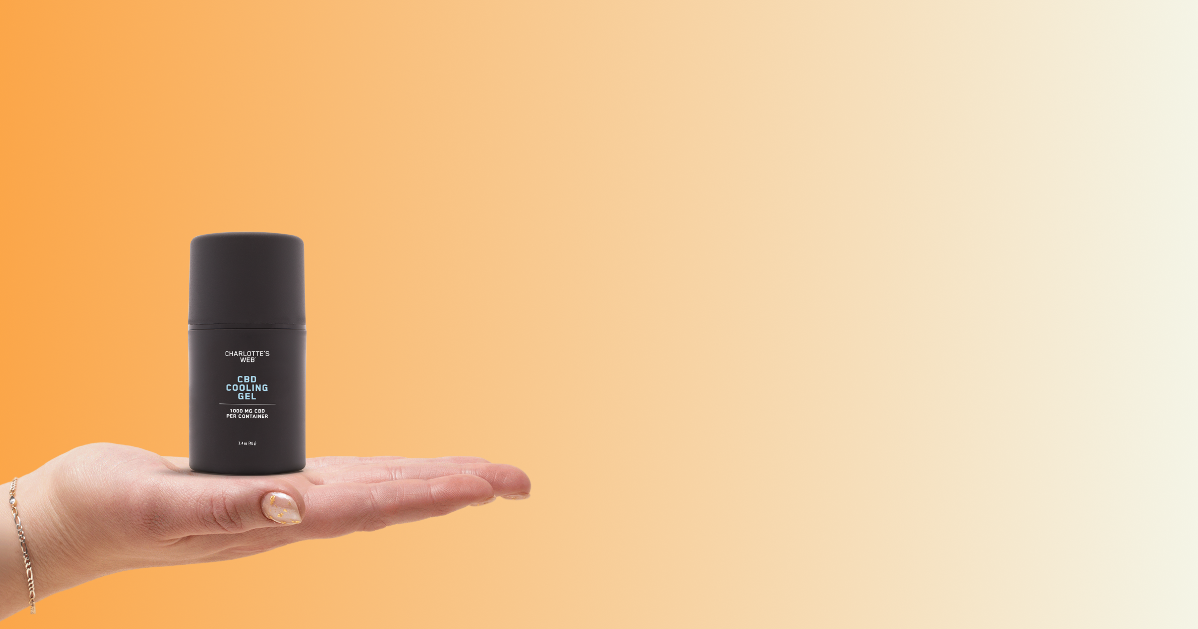 Palm holding a bottle of CBD cooling gel on an orange background