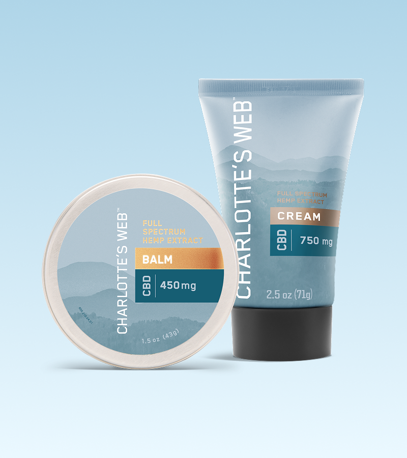 Charlotte's Web CBD balm and cream on a light blue background