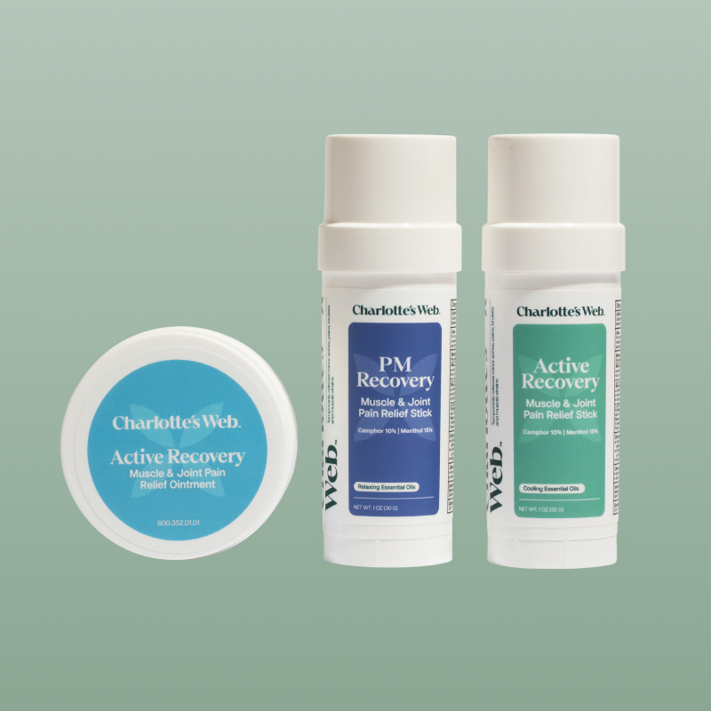 Three skincare products on a light green background